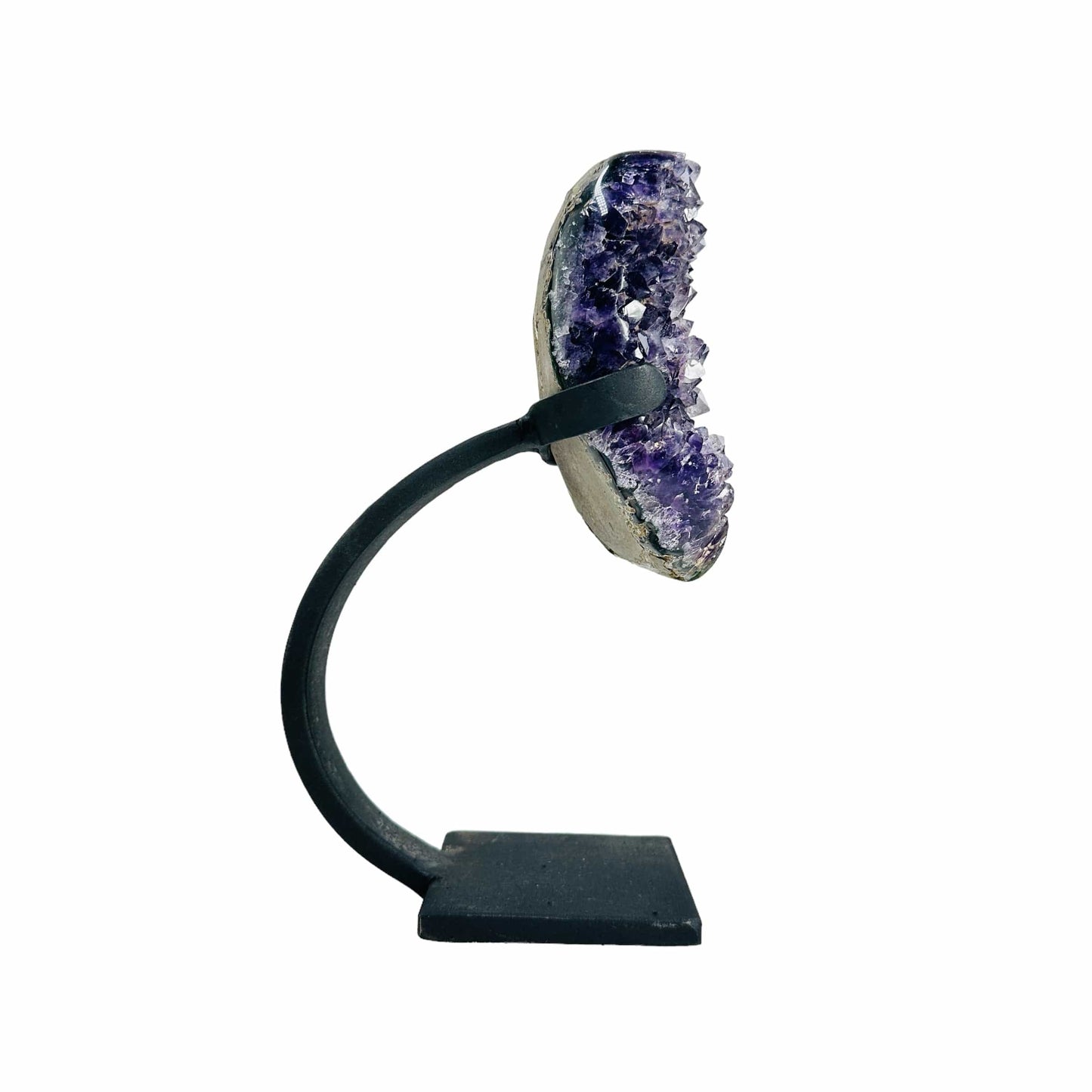 side view of amethyst with stand on white background