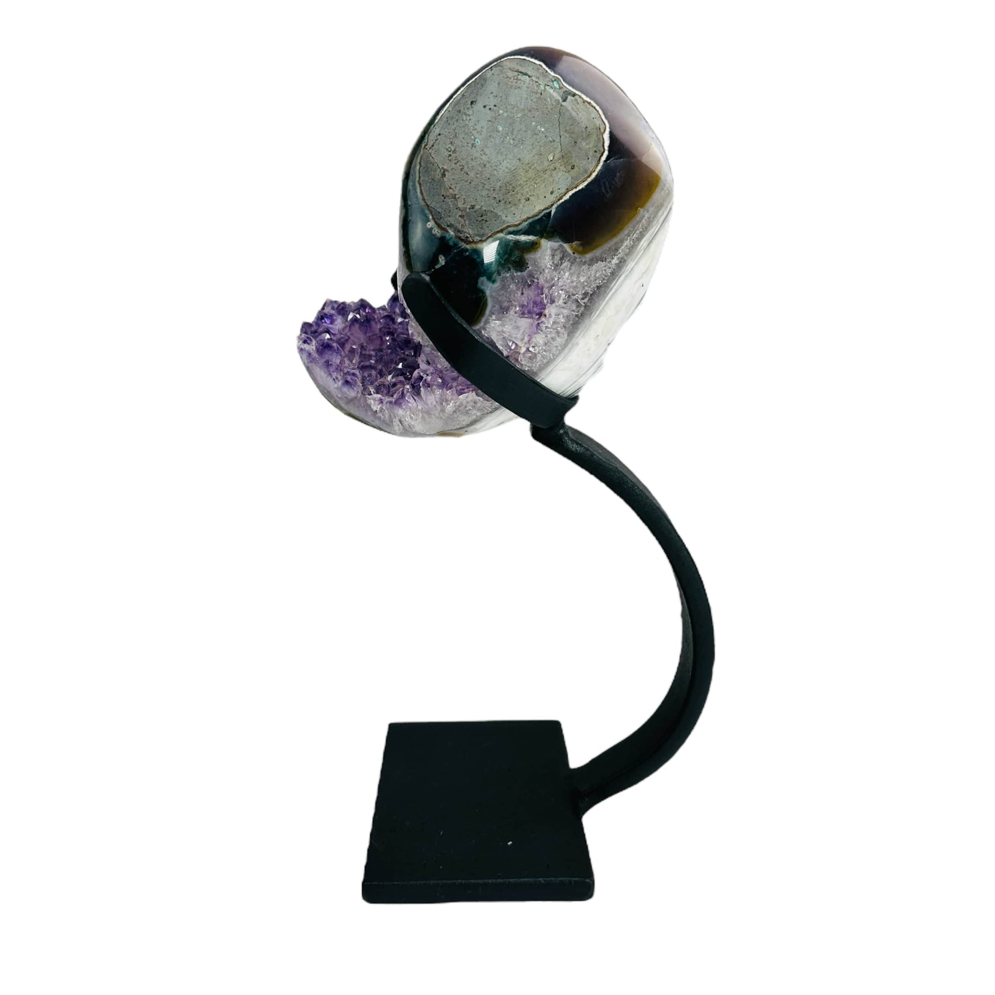 side view of amethyst with stand on white background