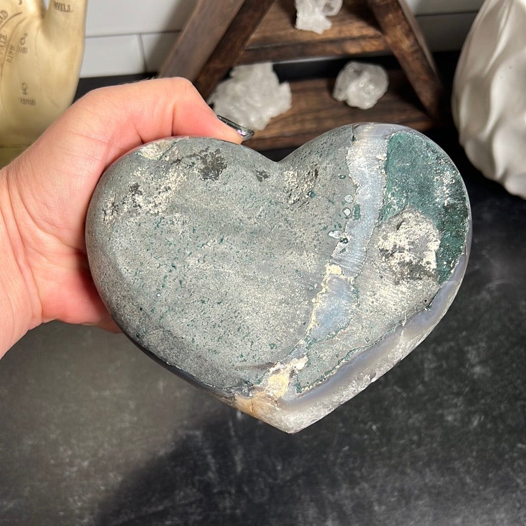 Back side of the amethyst heart showing it is gray with green basalt.