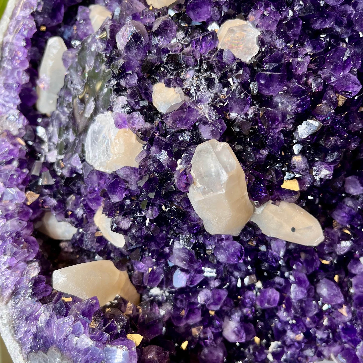 Up close view of crystal formations inside Large Dark Purple Amethyst and Calcite Geode.