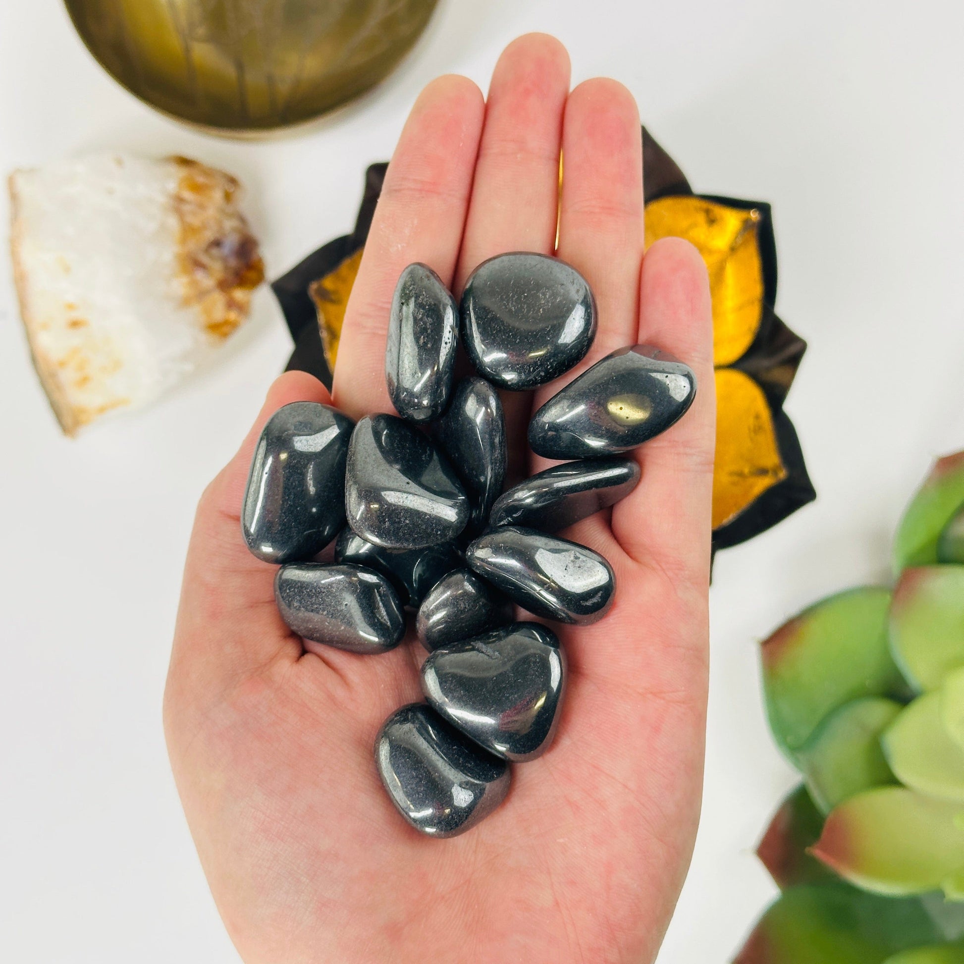 silver hematite in a hand