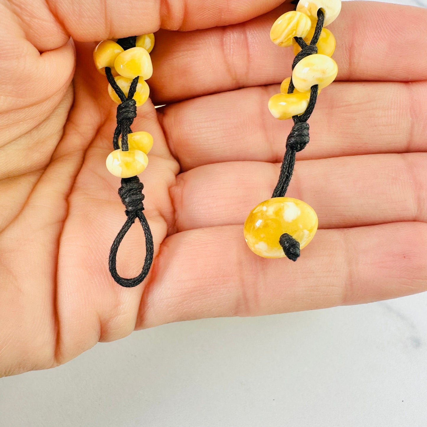 Up close view of the bead button closure, undone.