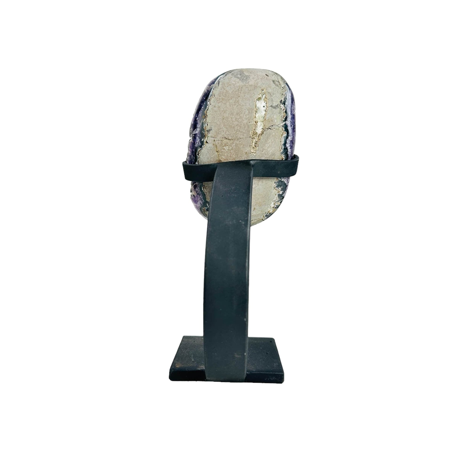 backside of amethyst with stand on white background