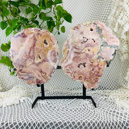 Pink amethyst pair wings with decorations in the background