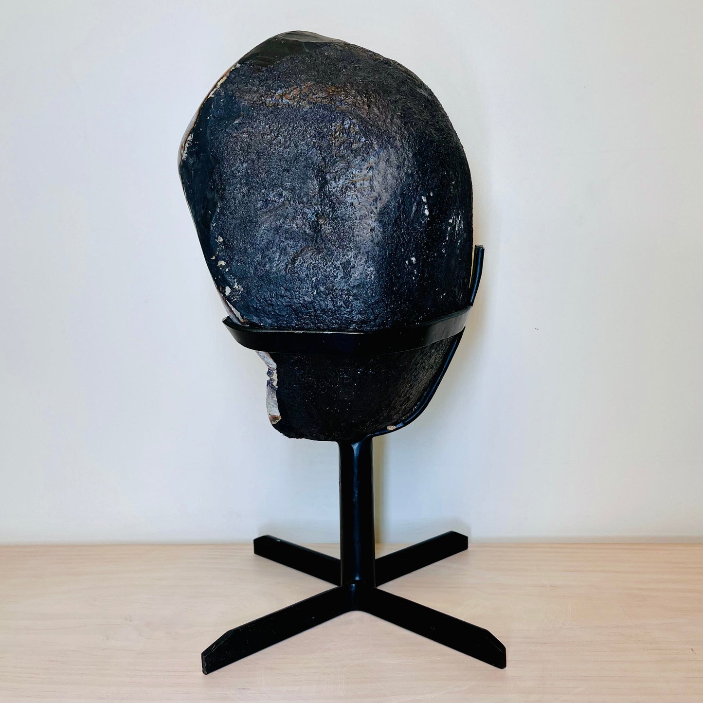Side view of Large Dark Purple Amethyst and Calcite Geode on Metal Stand.