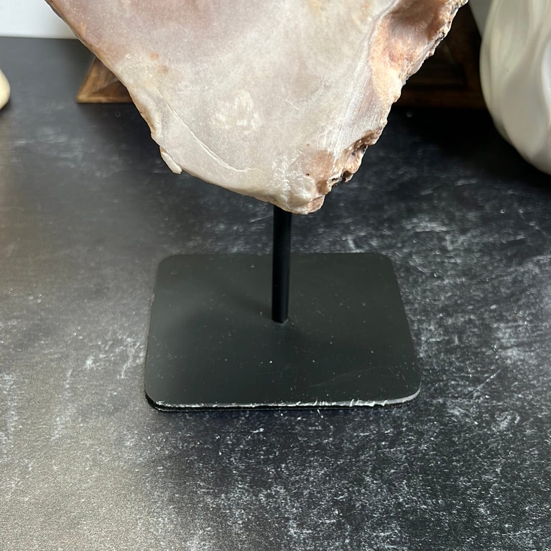 stand has some minor imperfections with paper stuck to it photo is a close up of the stand.