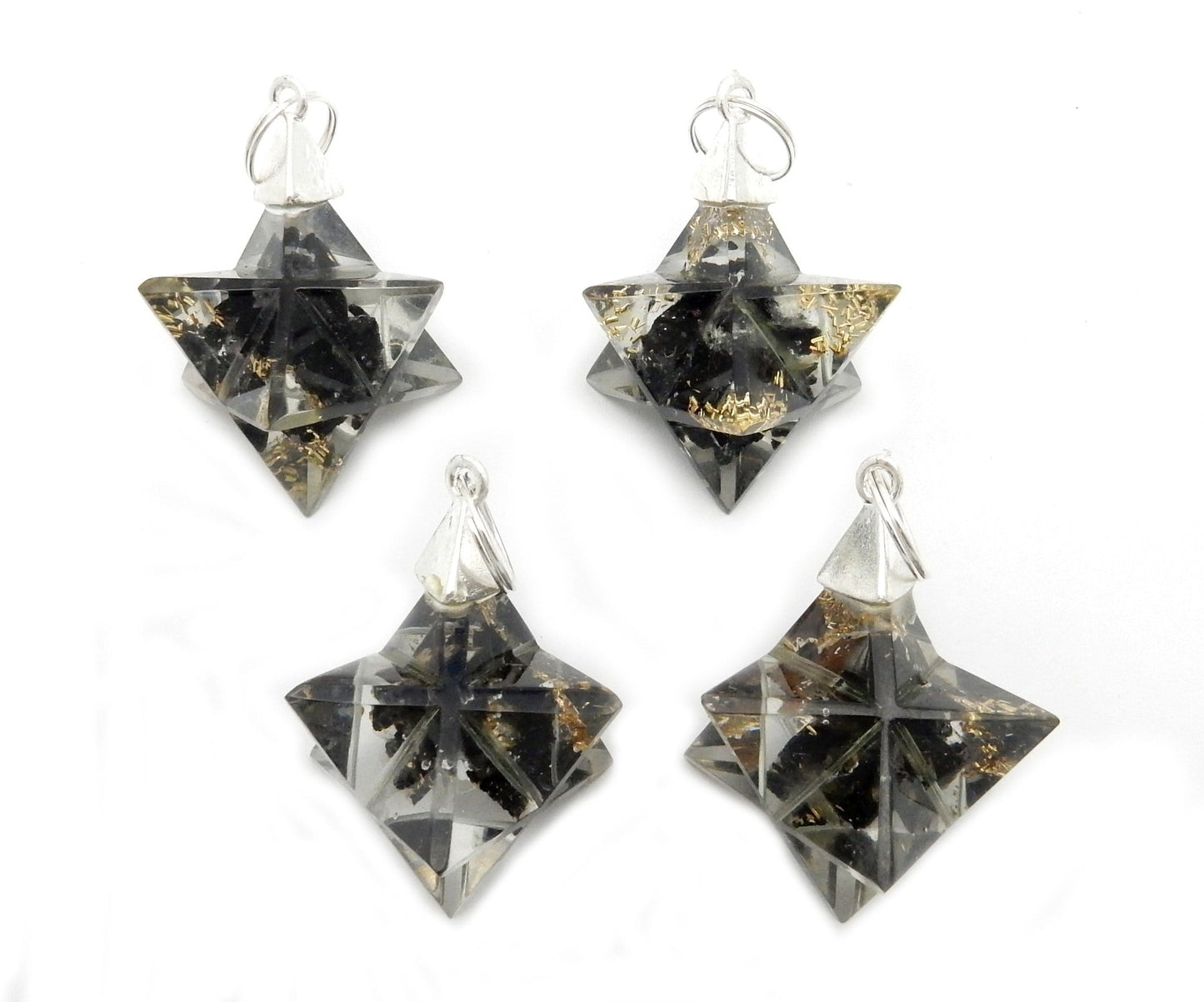 Merkaba - Merkaba Star Orgone Silver Toned Bail Pendant - dark colored 4 on a table