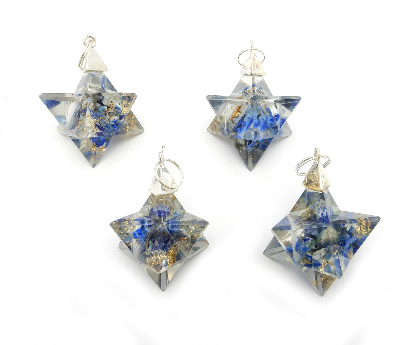merkaba star pendants on a table 