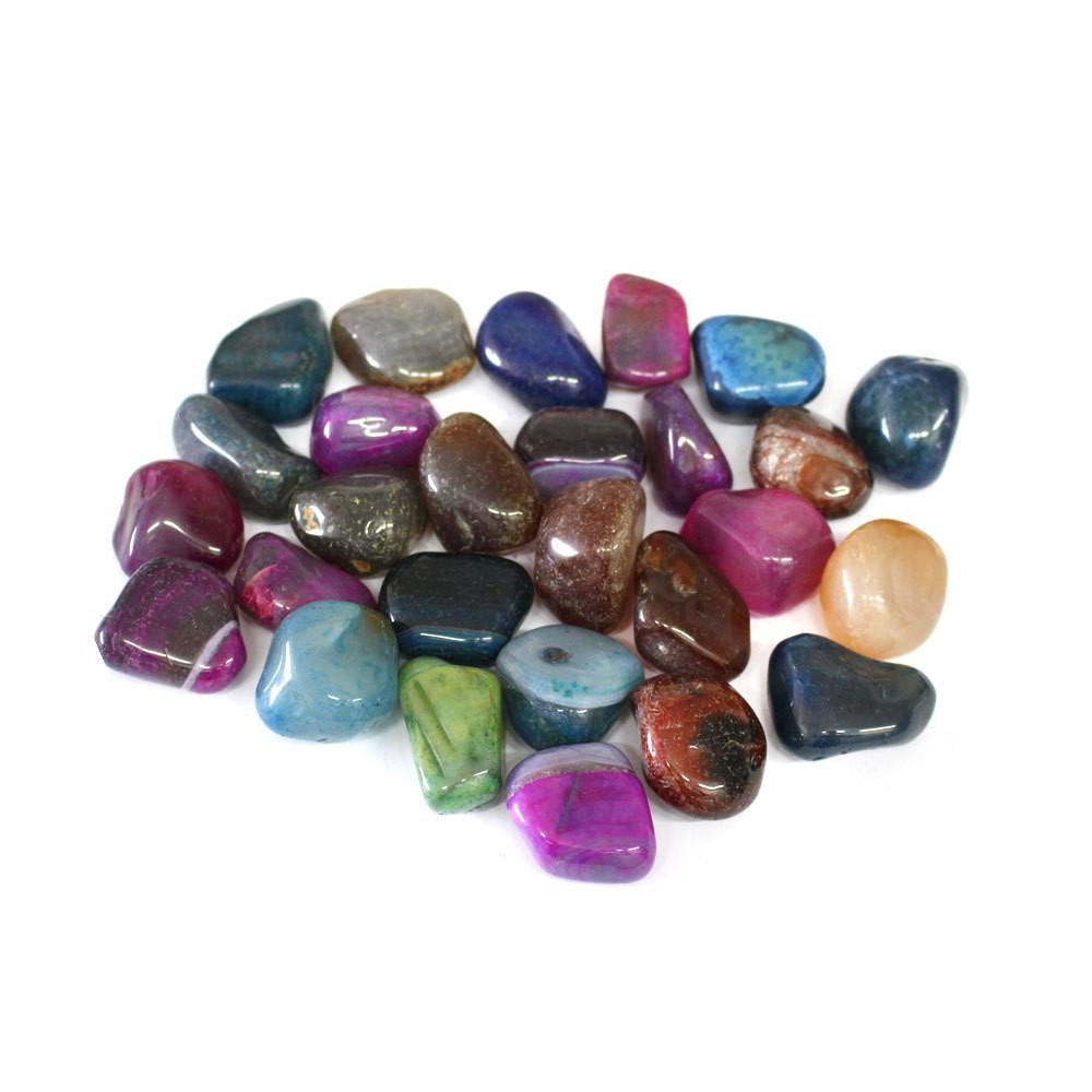 dyed tumbled agate on white background