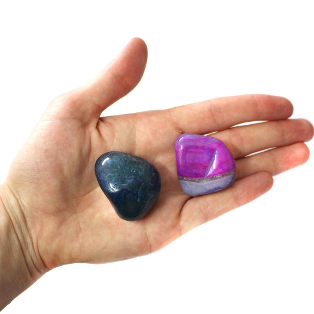 tumbled dyed agate in hand