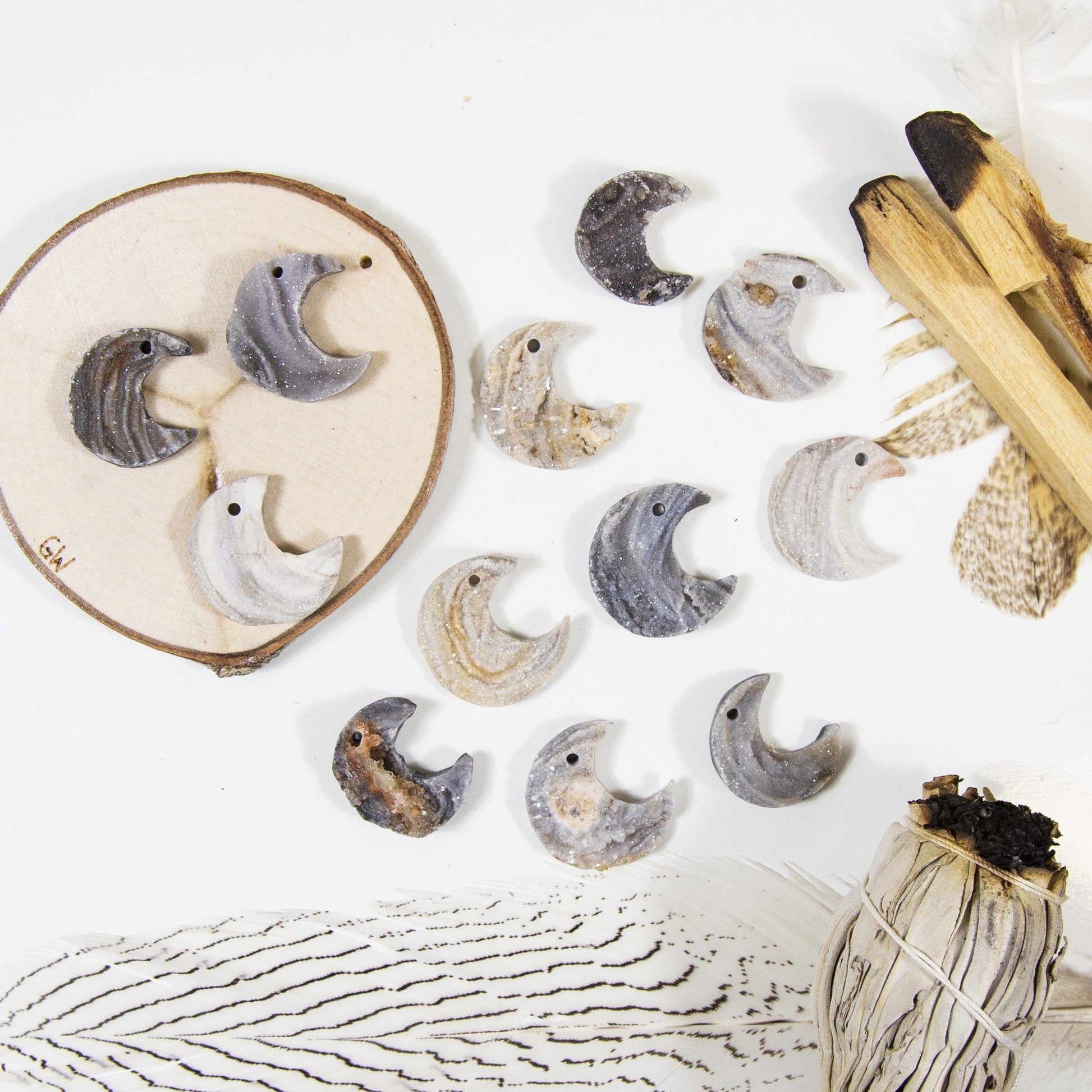 12 Raw Chalcedony Moon Crescents on white background with decorations