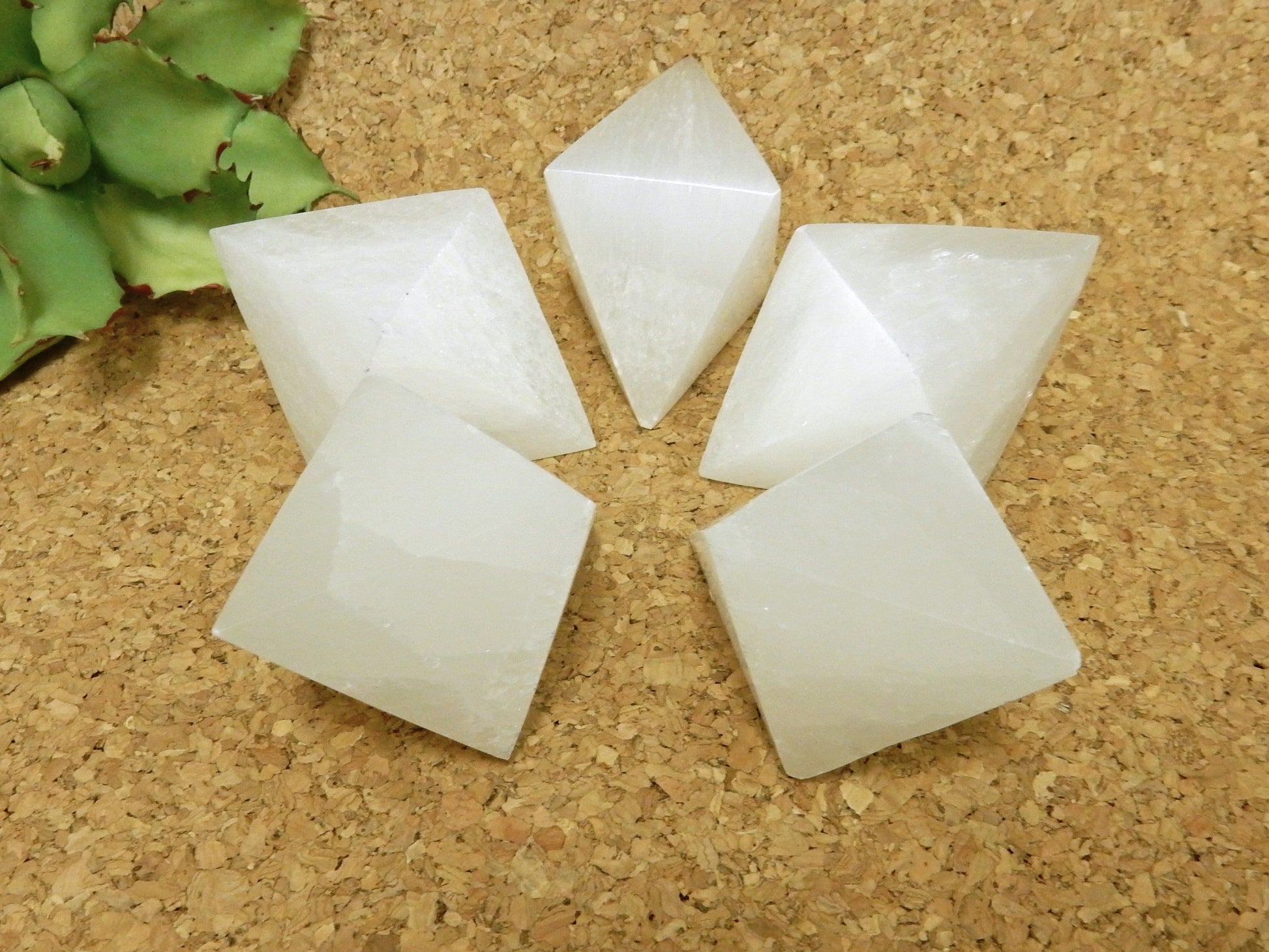 close up of selenite double pyramids on display for details and possible variations