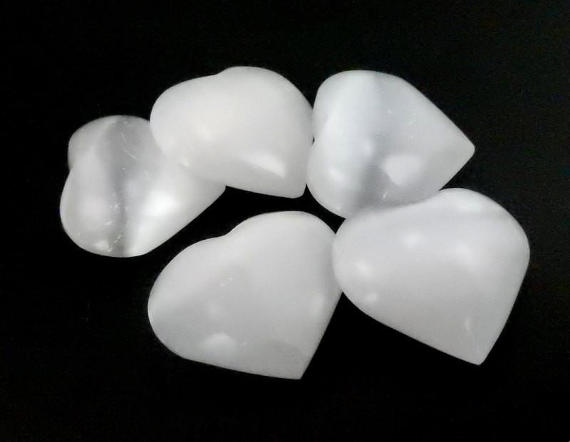 a pile of Selenite Heart Shaped Stones