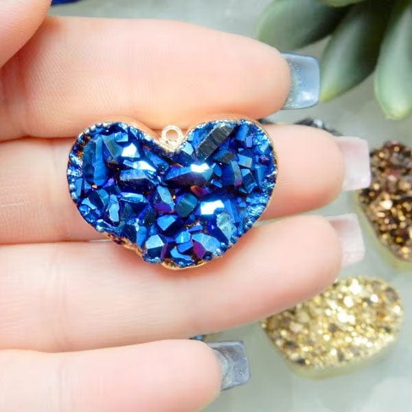 Mystic Druzy Heart Pendant with Electroplated 24k GoldEdge in a hand for size reference