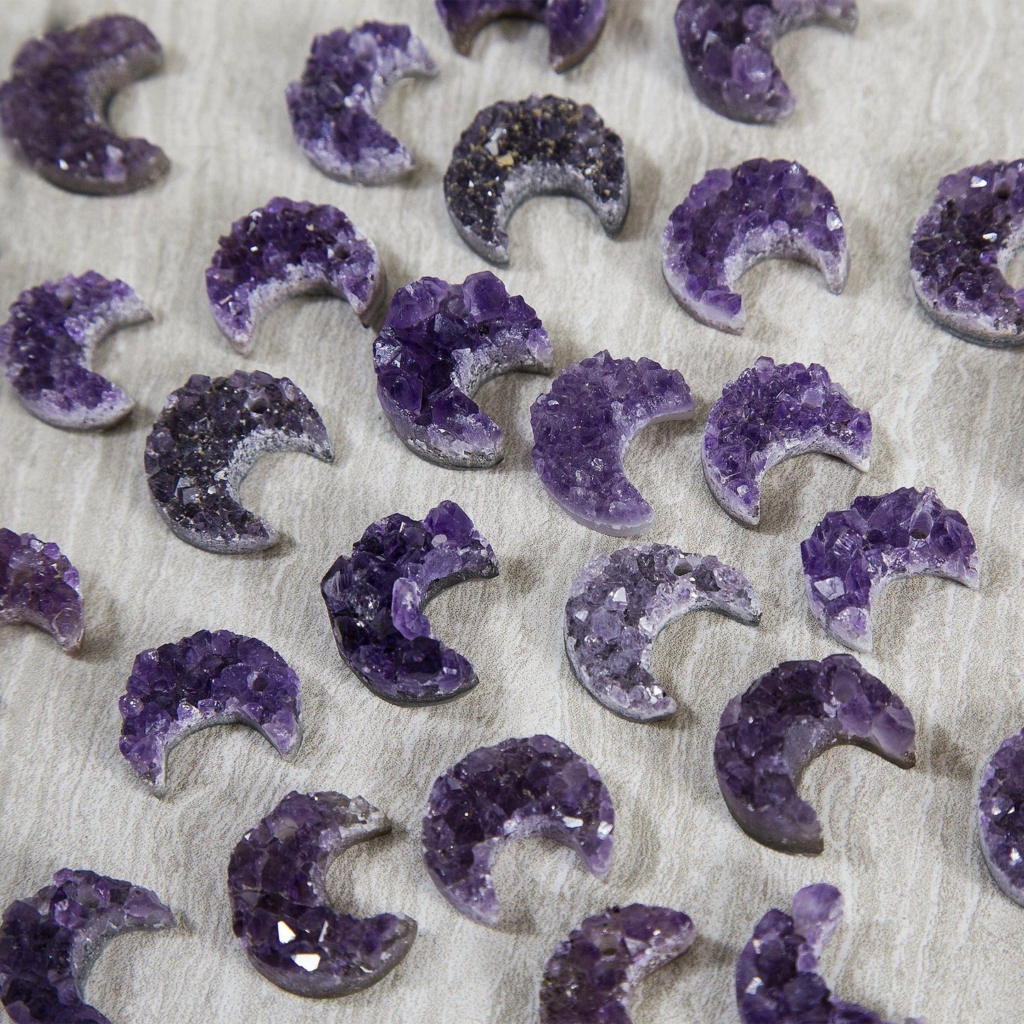 Amethyst cluster moons in assorted shades of purple to show how they vary.