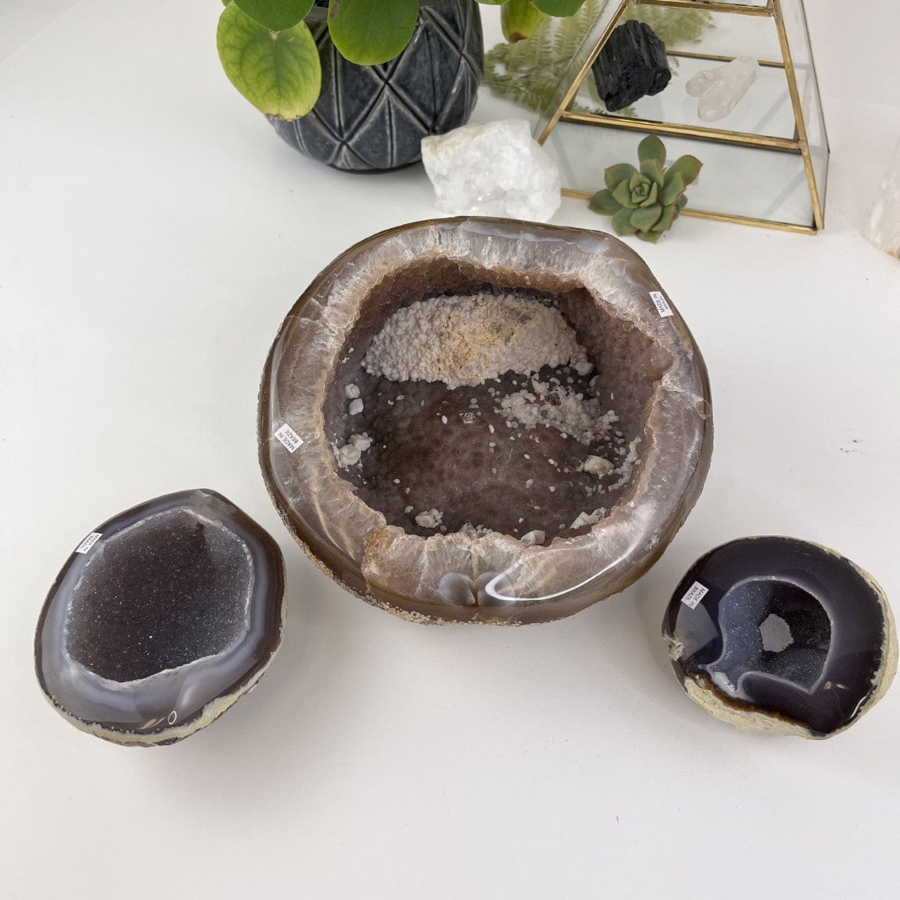 Bulk Lot 3 Polished Geode Halves on a table