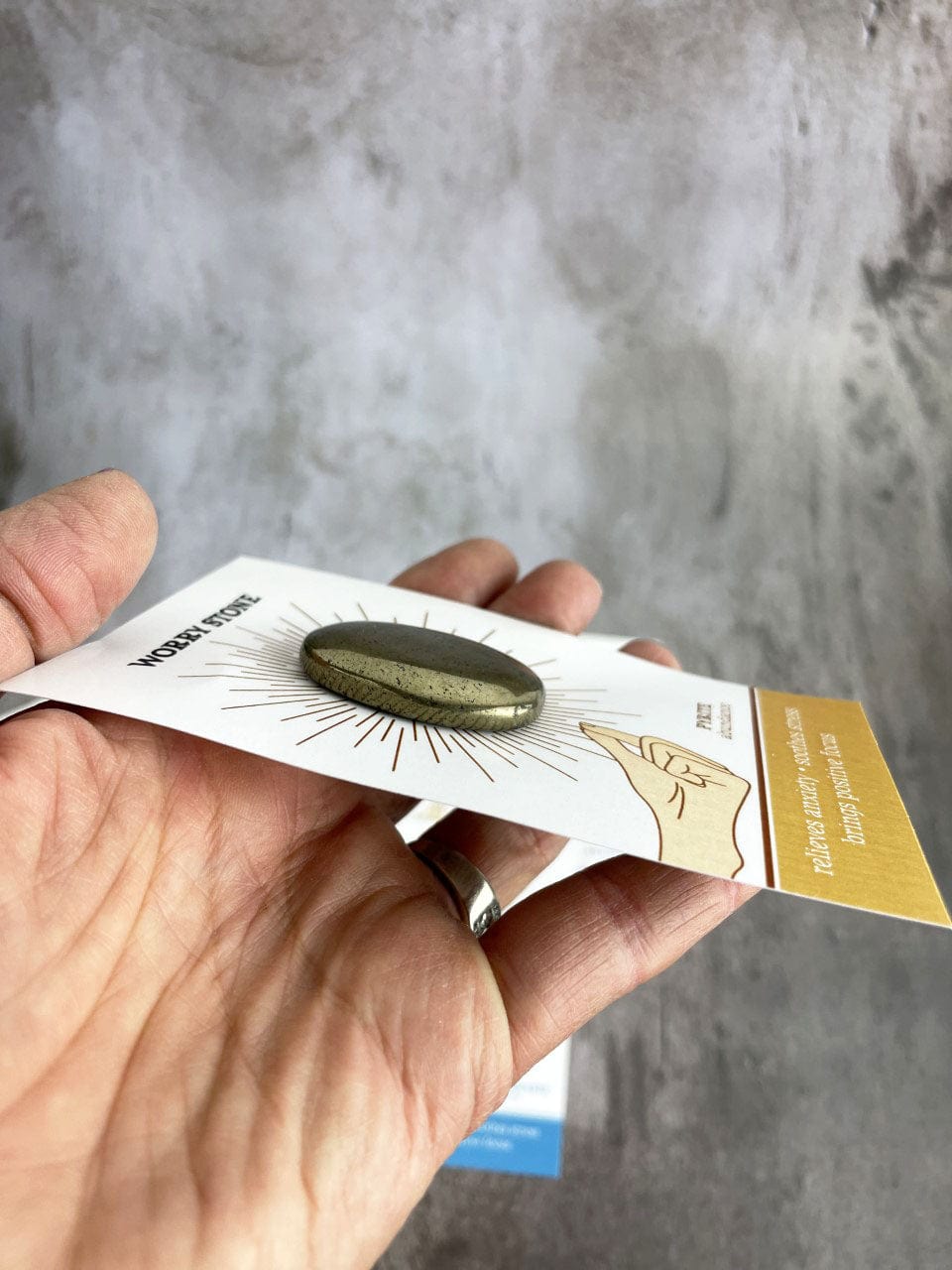 Pyrite Worrystone on a card side view