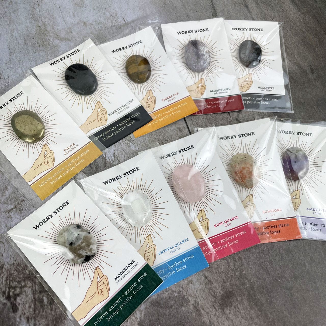 Worry Stone on Card in Protective Sleeve fanned out on a table