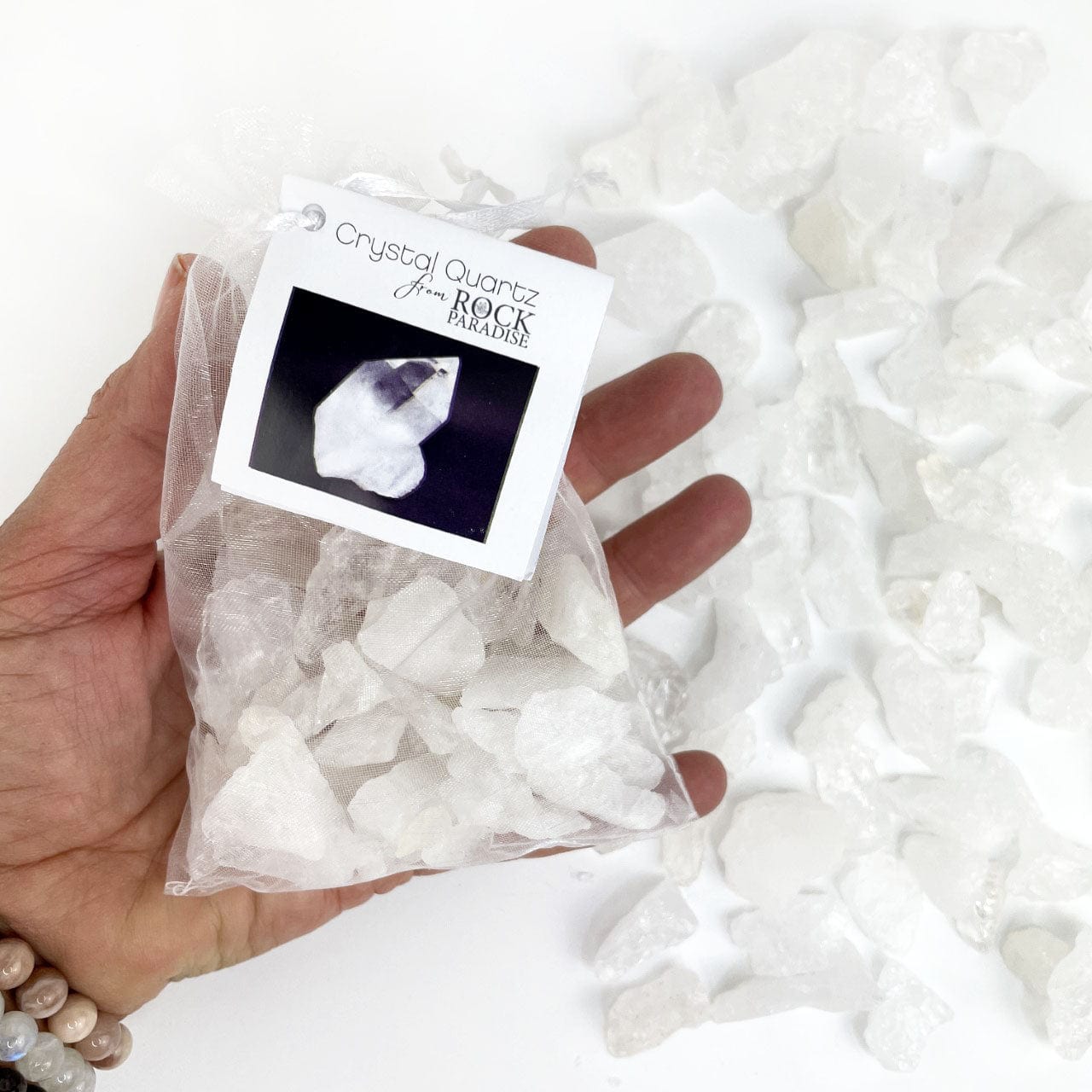 Crystal Quartz Stones - Tied & Tagged in an Organza Bag in a hand