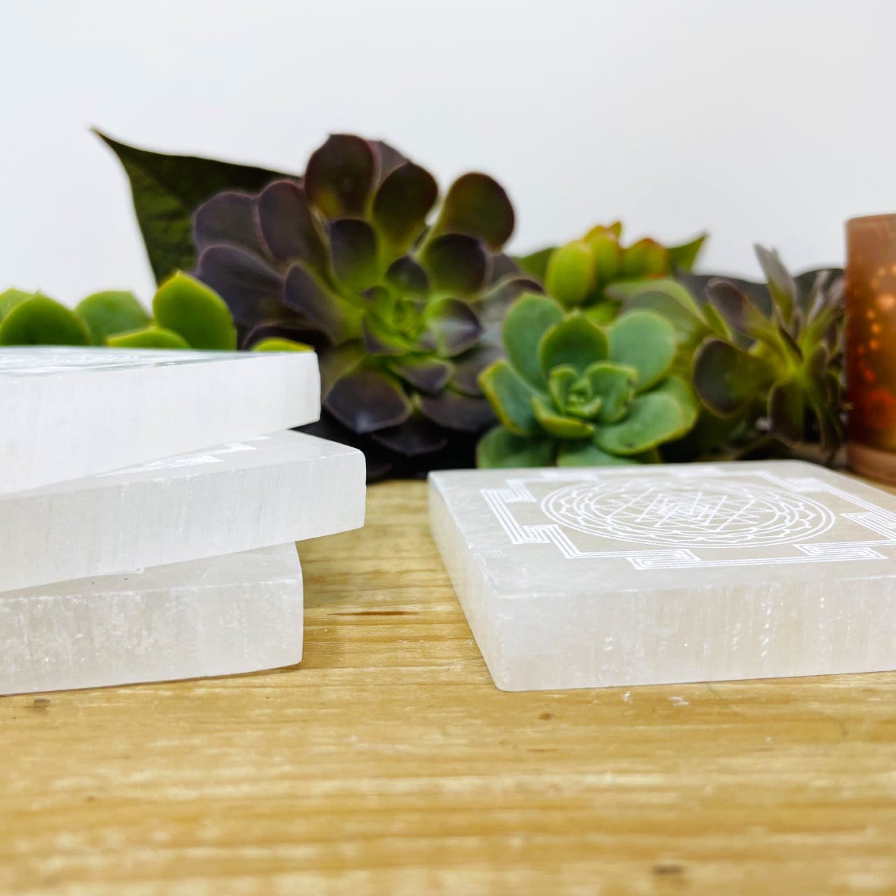 side view of selenite shri yantra mandala engraved square charging plates for thickness