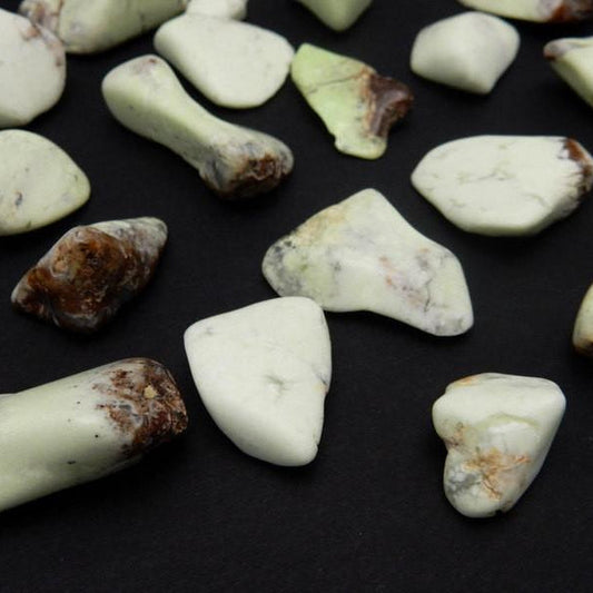 tumbled chrysoprase on a table