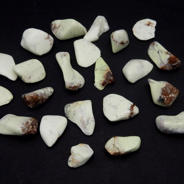 tumbled chrysoprase on a table